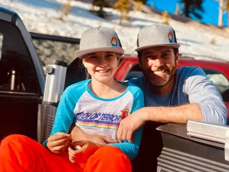 Friends wearing outdoor caps together on a sunny day